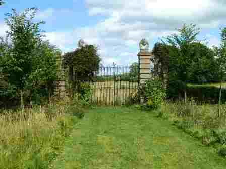 The locked gates of hellens Manor which have remained locked for over four hundred year.