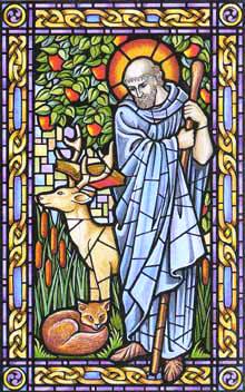 Stained glass window showing St Piran.