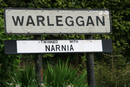 Sign for the village of Warleggan reading that it is "twinned with Narnia."