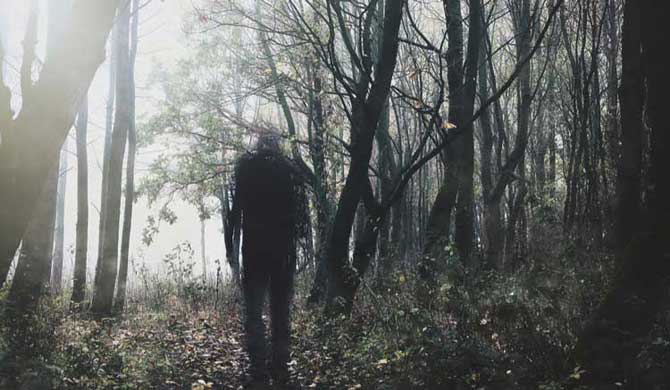 A ghostly figure in a wood.