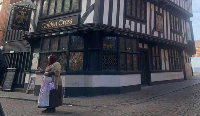 Hideous History Guide outside the Golden Cross, Coventry.