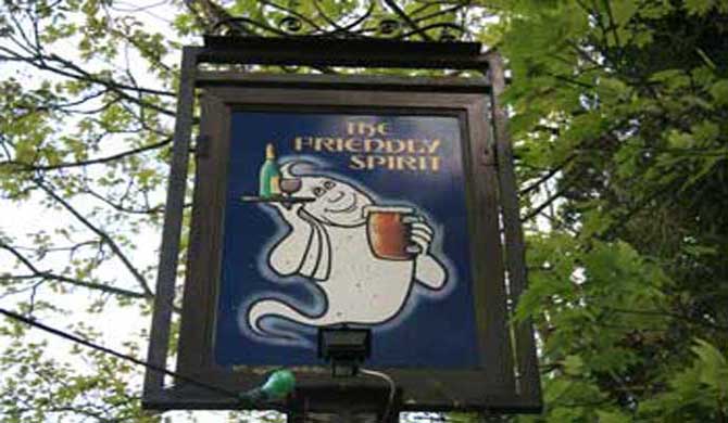 The sign for the Friendly Spirit Inn.