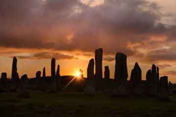 A stone circle by night.