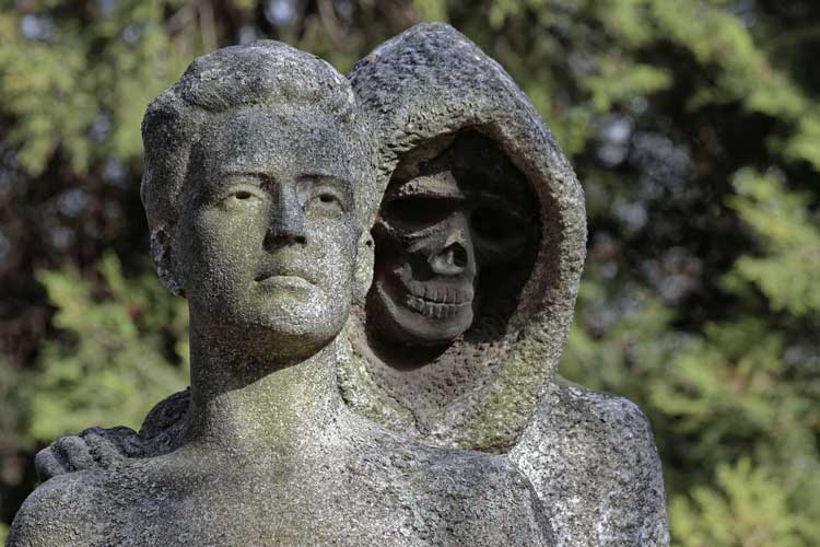 Statue of death lurking behind a lady.
