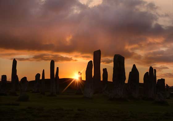 A mysterious stone circle seen at night.