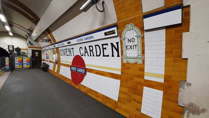 The platform of Covent Garden Underground Station showing the tiling.