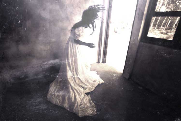 A ghostly woman in a white dress.